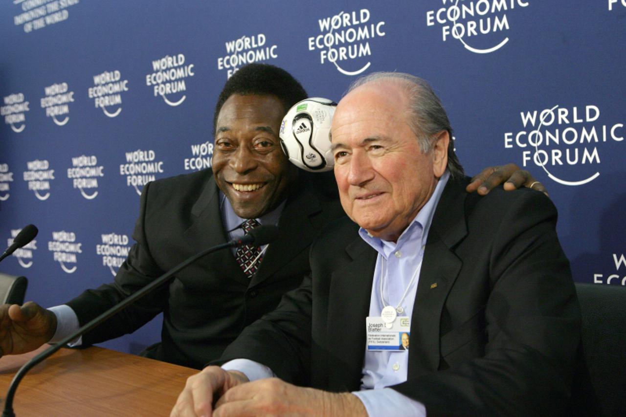 'DAVOS/SWITZERLAND, 26JAN06 - Edson Arantes do Nascimento (Pele), World Cup Soccer Champion and Director, Empresas Pele, Brazil and Joseph S. Blatter, President, Federation Internationale de Football 