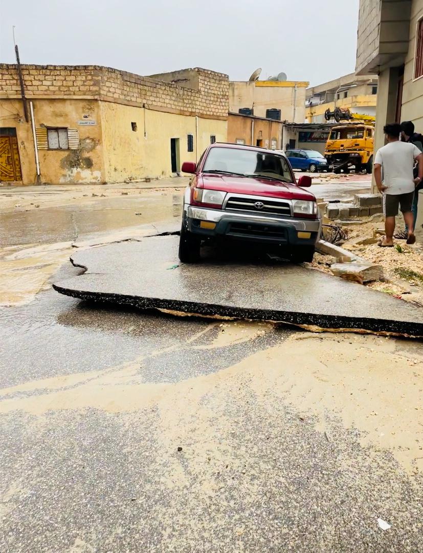 A view shows a damaged car on a broken road, after a powerful storm and heavy rainfall hit, in Al Bayda, Libya, September 11, 2023, in this screengrab obtained from social media video. Instagram/@EX5TWD via REUTERS. ATTENTION EDITORS - THIS IMAGE HAS BEEN SUPPLIED BY A THIRD PARTY. MANDATORY CREDIT. NO RESALES. NO ARCHIVES Photo: INSTAGRAM/@EX5TWD/REUTERS