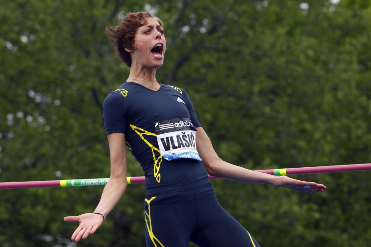 'Blanka Vlasic of Croatia celebrates clearing the bar at 1.91 meters on her way to winning the women\'s high jump   at the Diamond League Adidas Grand Prix in New York, May 25, 2013. REUTERS/Gary Hers