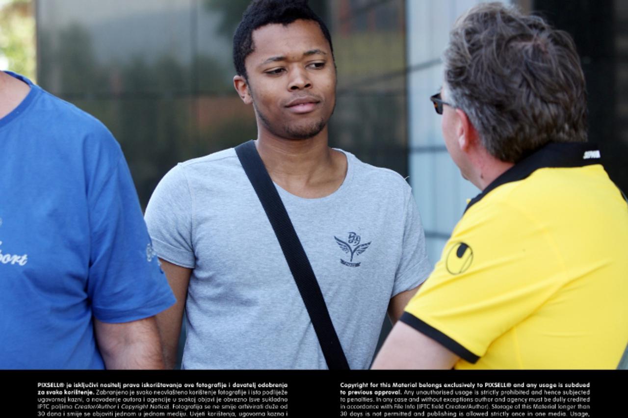 '03.07.2013., Zagreb - Nogometas Alieu Darbo sa menadjerom Bozom Sliskovicem izlazi iz poliklinike Sunce i odlati s privatnim vozacem u sivom BMW- u.    Photo: Goran Jakus/PIXSELL'