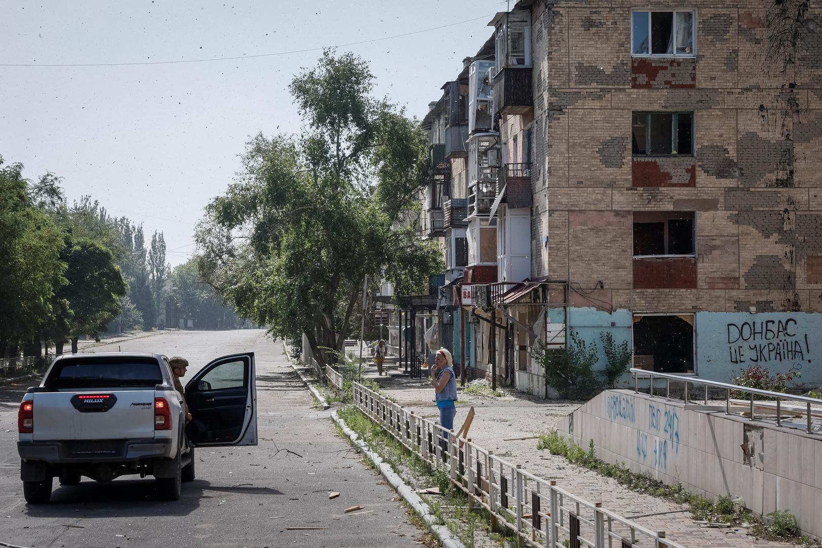 Ivan, 35, Ukrainian police officer, convinces a local resident, who refuses to be evacuated, to change her mind and leave the town, amid Russia's attack on Ukraine, in the town of Toretsk, near a front line in Donetsk region, Ukraine July 3, 2024. REUTERS/Alina Smutko Photo: ALINA SMUTKO/REUTERS