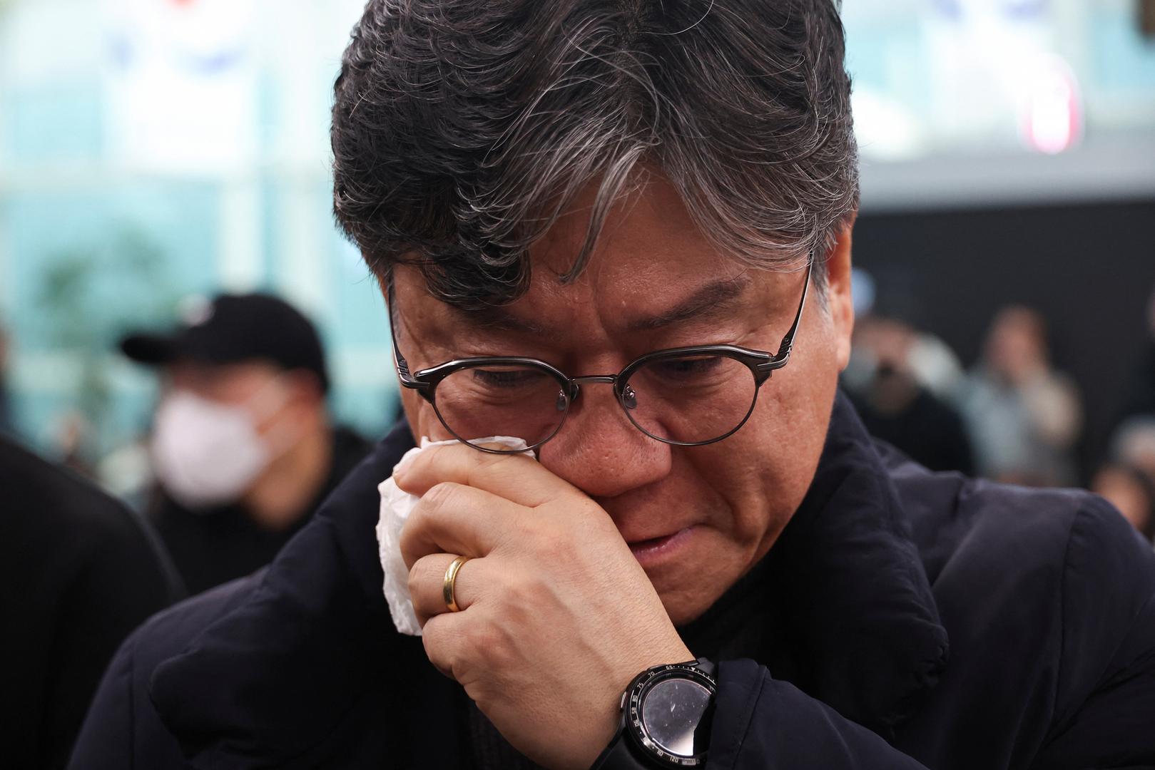 A relative of a passenger of the aircraft that crashed after it went off the runway, reacts at Muan International Airport, in Muan, South Korea, December 29, 2024. REUTERS/Kim Hong-Ji Photo: KIM HONG-JI/REUTERS