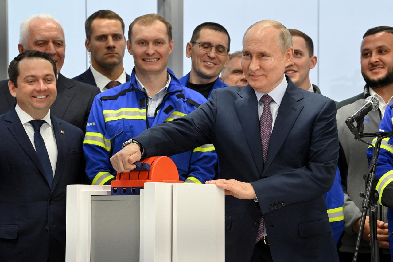 FILE PHOTO: Russian President Putin launches the first natural gas liquefaction line on a gravity-type base for the Arctic LNG-2 project in Murmansk region