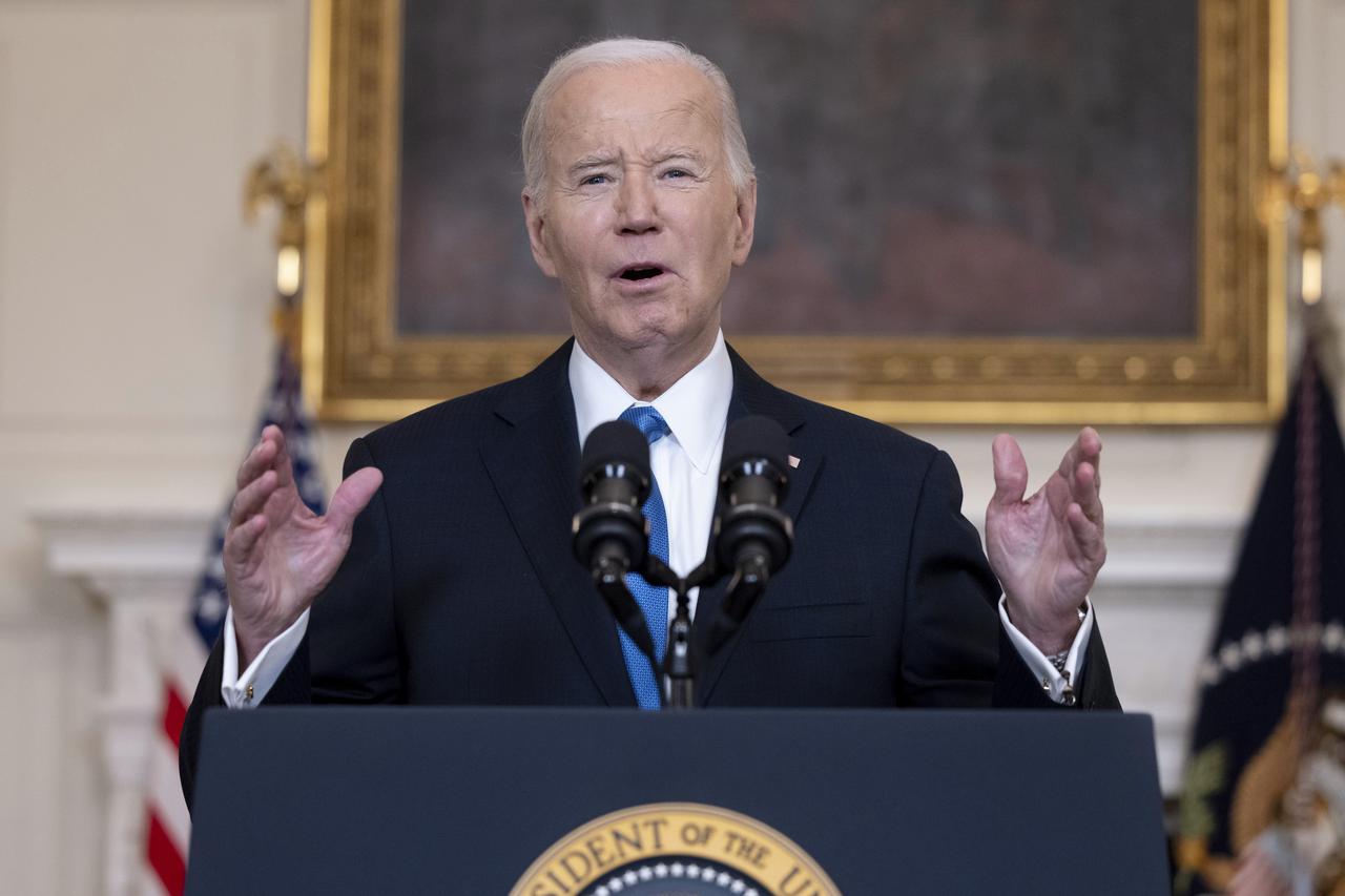 US President Joe Biden delivers remarks in the State Dining Room of the White House