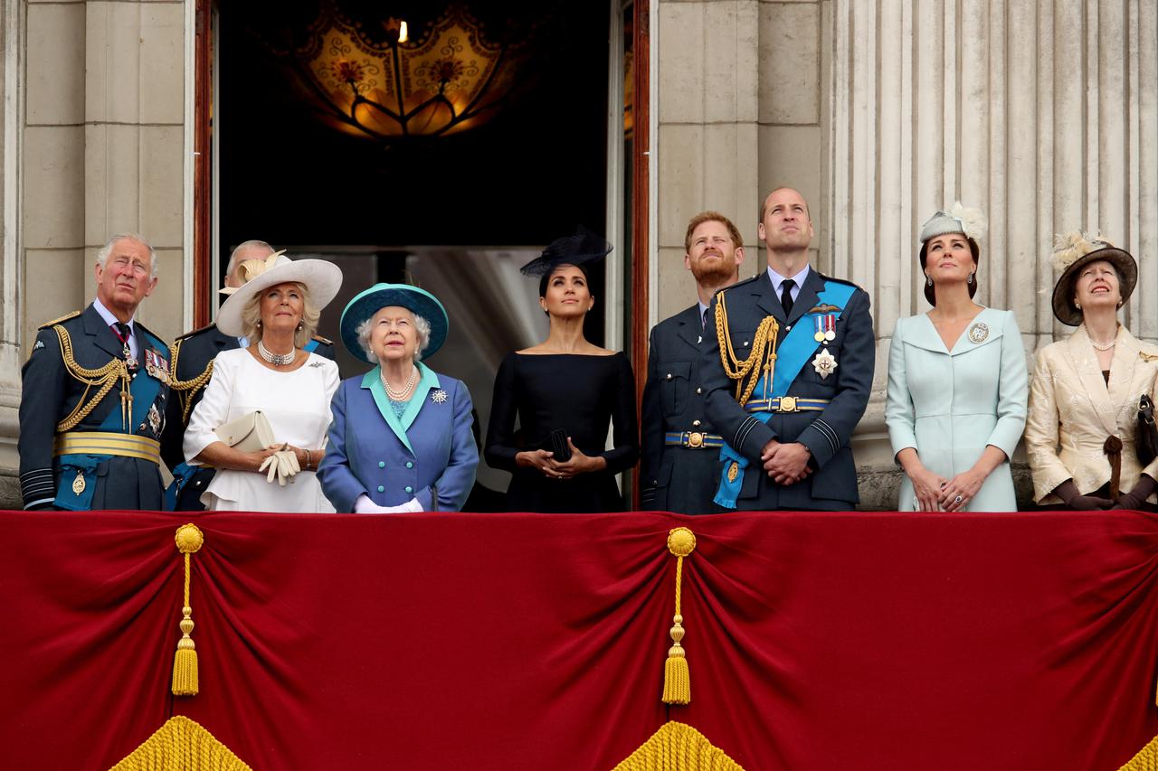 FILE PHOTO: Britain's Queen Elizabeth is joined by members of the Royal Family on the balcony of Buckingham Palace as they watch a fly past to mark the centenary of the Royal Air Force in central London