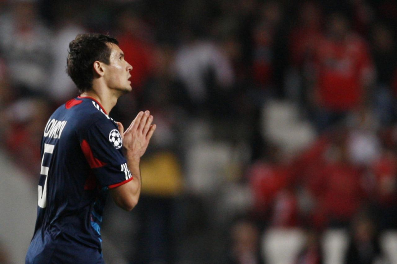 'Olympique Lyon\'s Dejan Lovren celebrates his goal against Benfica during their Champions League Group B soccer match at Luz stadium in Lisbon November 2, 2010.   REUTERS/Hugo Correia (PORTUGAL - Tag