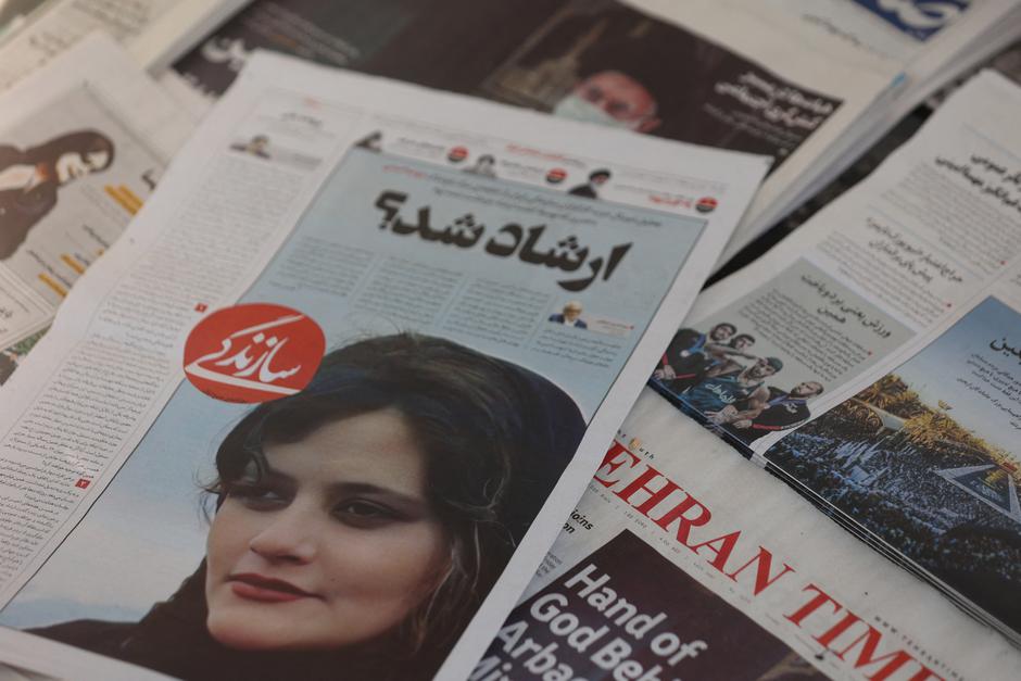 Newspapers with Amini, a victim of country's "morality police", are seen in Tehran