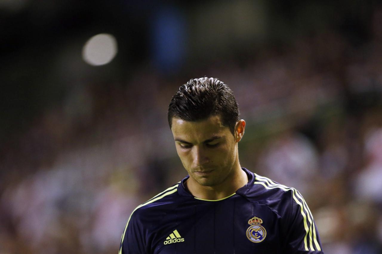 'Real Madrid\'s Cristiano Ronaldo reacts after a missed scoring opportunity against Rayo Vallecano during their Spanish First Division soccer match at Teresa Rivero stadium in Madrid September 24, 201