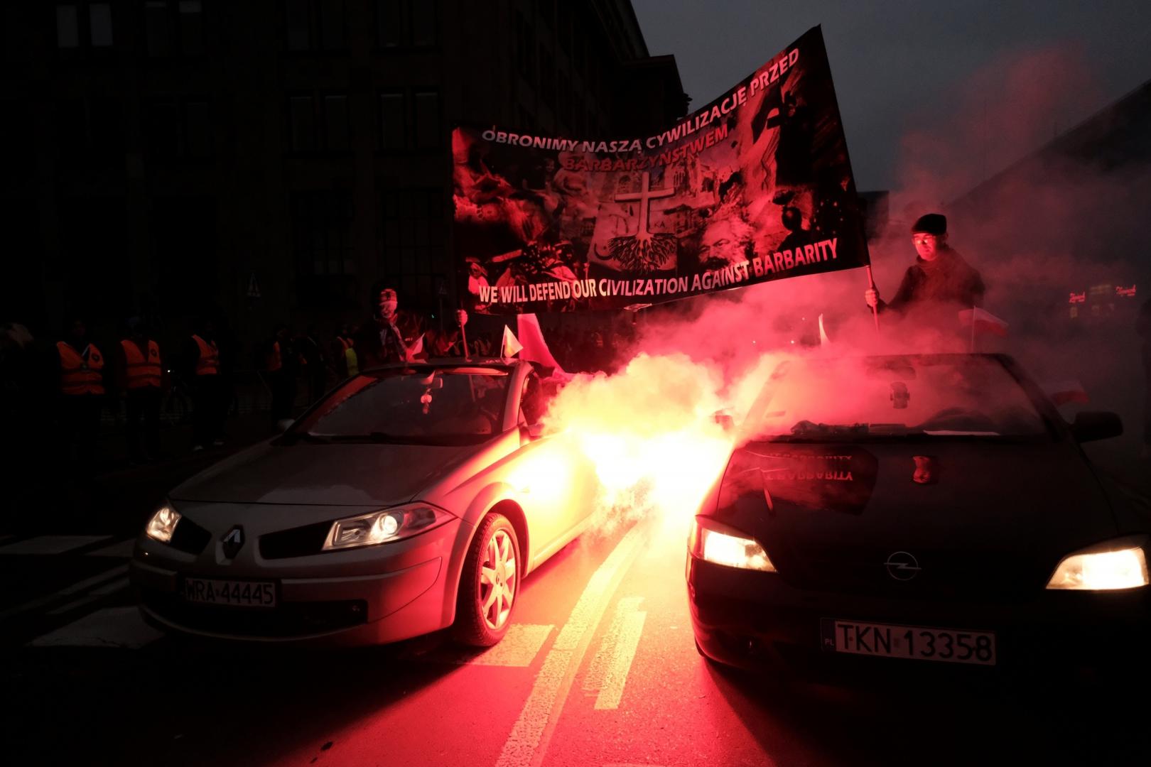 People mark the National Independence Day in Warsaw Demonstrators hold a banner while riding in cars during a march marking the National Independence Day in Warsaw, Poland November 11, 2020. Slawomir Kaminski/Agencja Gazeta/via REUTERS   ATTENTION EDITORS - THIS IMAGE WAS PROVIDED BY A THIRD PARTY. POLAND OUT. NO COMMERCIAL OR EDITORIAL SALES IN POLAND. SLAWOMIR KAMINSKI