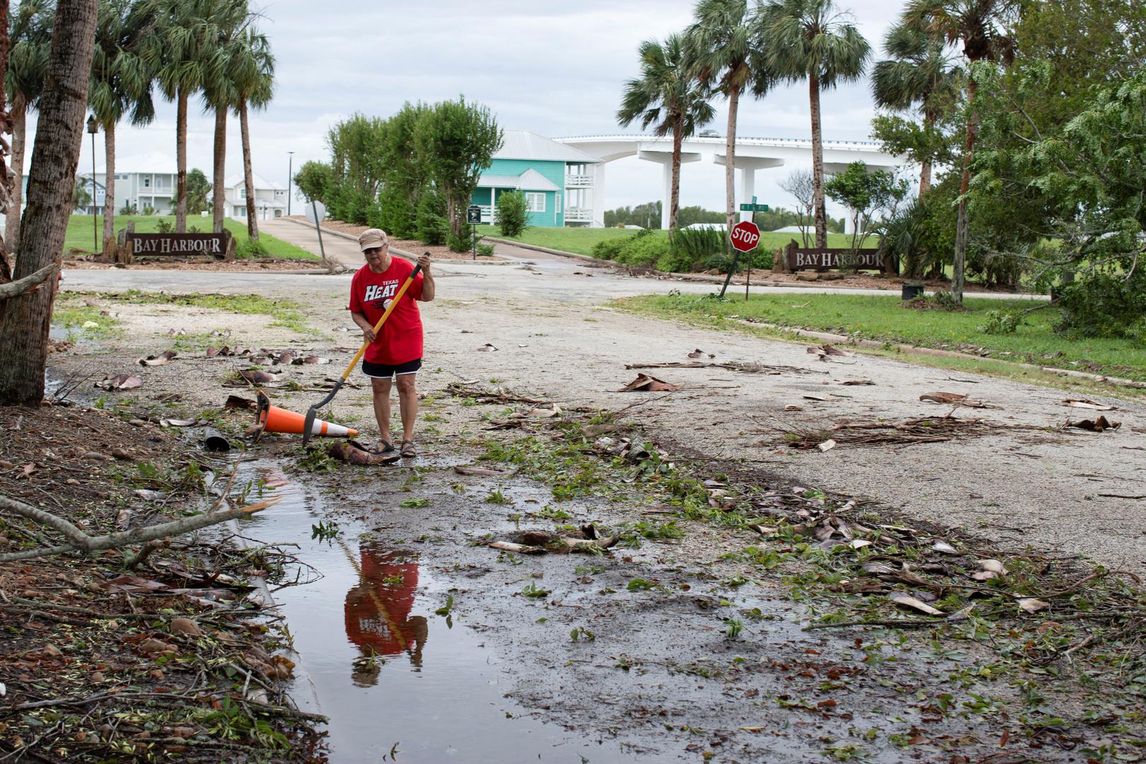 Marguerite Cruti clears debris from culverts to allow standing water to flow after Hurricane Beryl moved through the area in Matagorda, Texas, U.S. July 8, 2024.  REUTERS/Kaylee Greenlee Beal Photo: KAYLEE GREENLEE BEAL/REUTERS