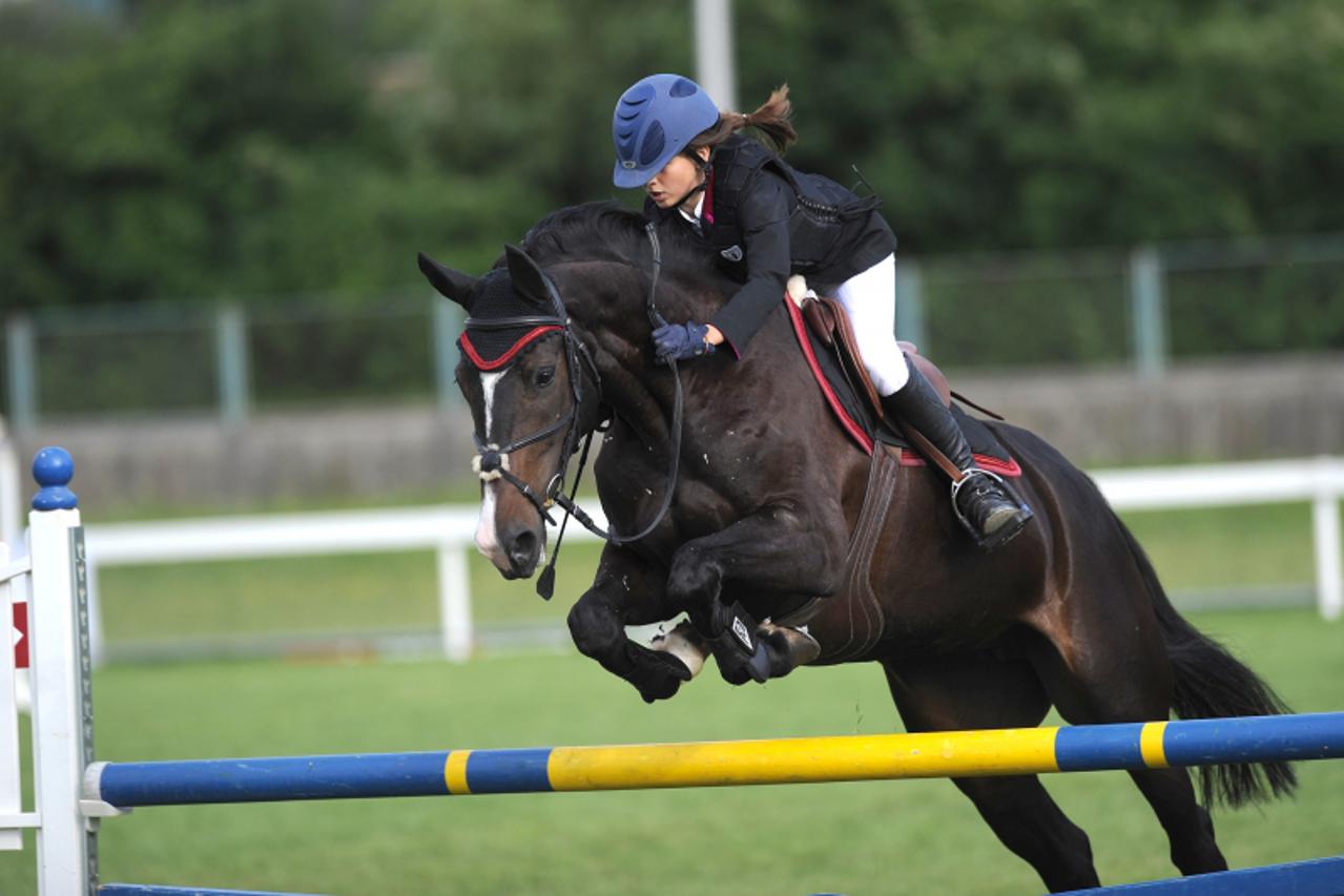 '19.06.2011. Hipodrom, Zagreb - 56. Medjunarodni lipanjski turnir u preponskom jahanju na Hipodromu , pobjednice u stafeti Ema Bezik i Antea Simlesa . Photo: Daniel Kasap/PIXSELL'