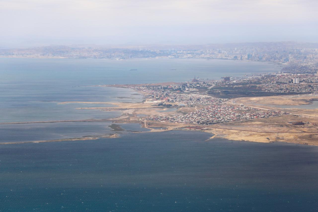 FILE PHOTO: An aerial view of the Caspian Sea near the city of Baku is pictured through the window of Turkish Airlines airplane, ahead of Europa League Final, in Baku