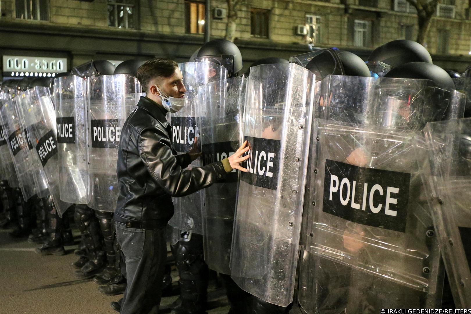 A person addresses police officers, who stand guard during a rally against the "foreign agents" law in Tbilisi, Georgia, March 8, 2023. REUTERS/Irakli Gedenidze Photo: IRAKLI GEDENIDZE/REUTERS