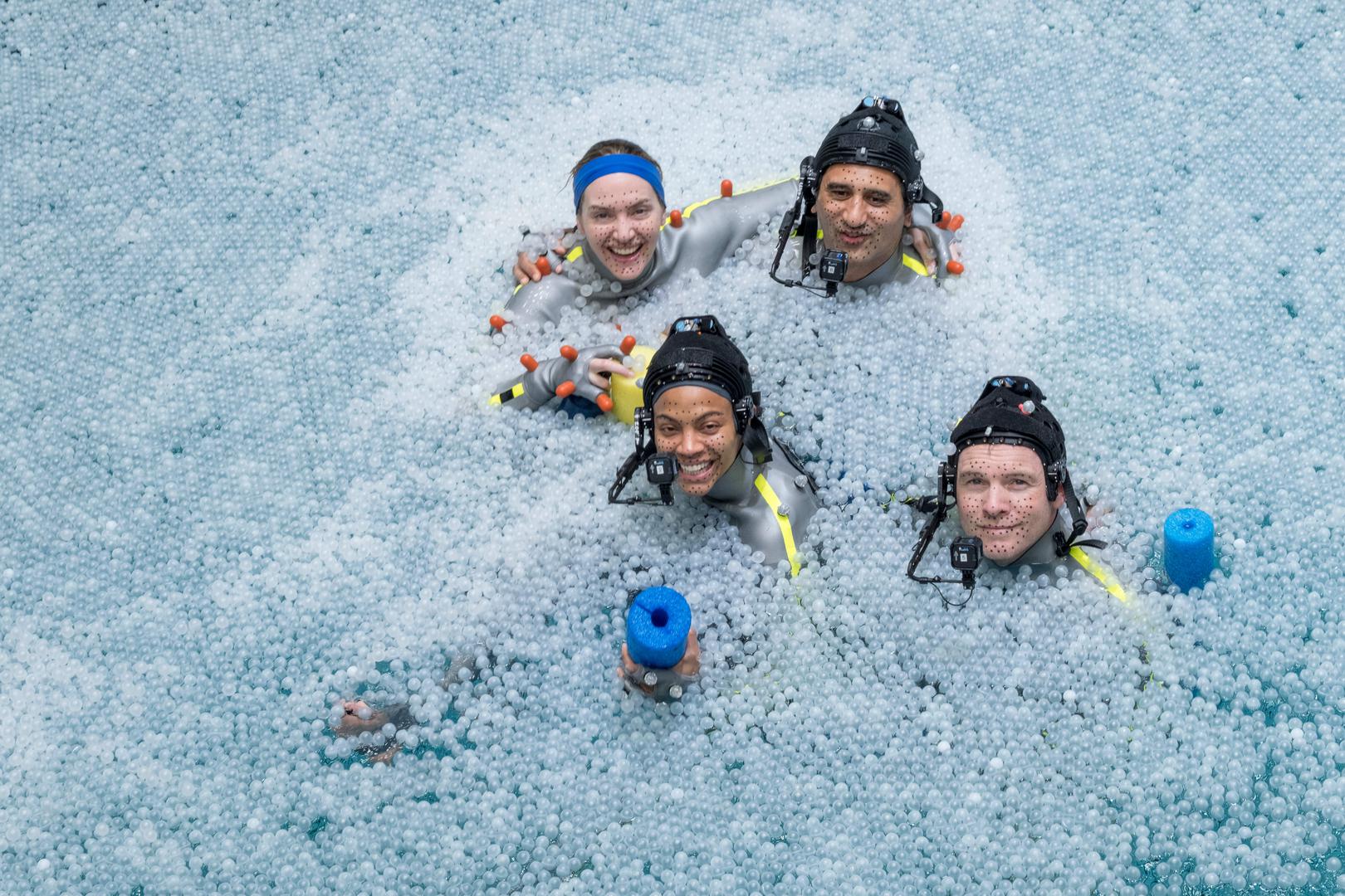 (L-R, Front to Back): Zoe Saldana, Sam Worthington, Kate Winslet, and Cliff Curtis on the set of 20th Century Studios' AVATAR: THE WAY OF WATER. Photo Credit: Mark Fellman/20th Century Studios.