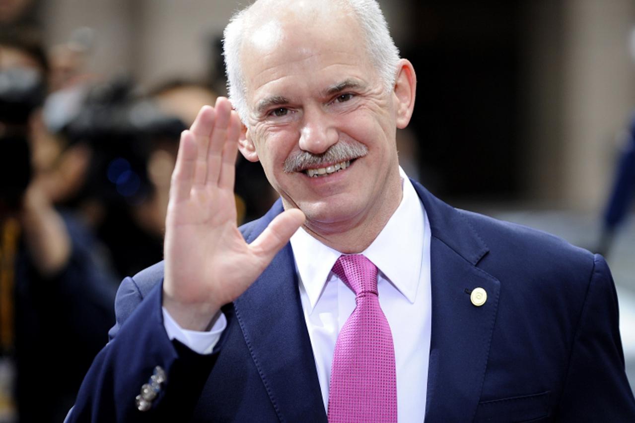 'Greek Prime Minister George A. Papandreou speaks to media upon arrival at an European Union summit at the European Council headquarters on March 26, 2010 in Brussels. The euro firmed on Friday but st