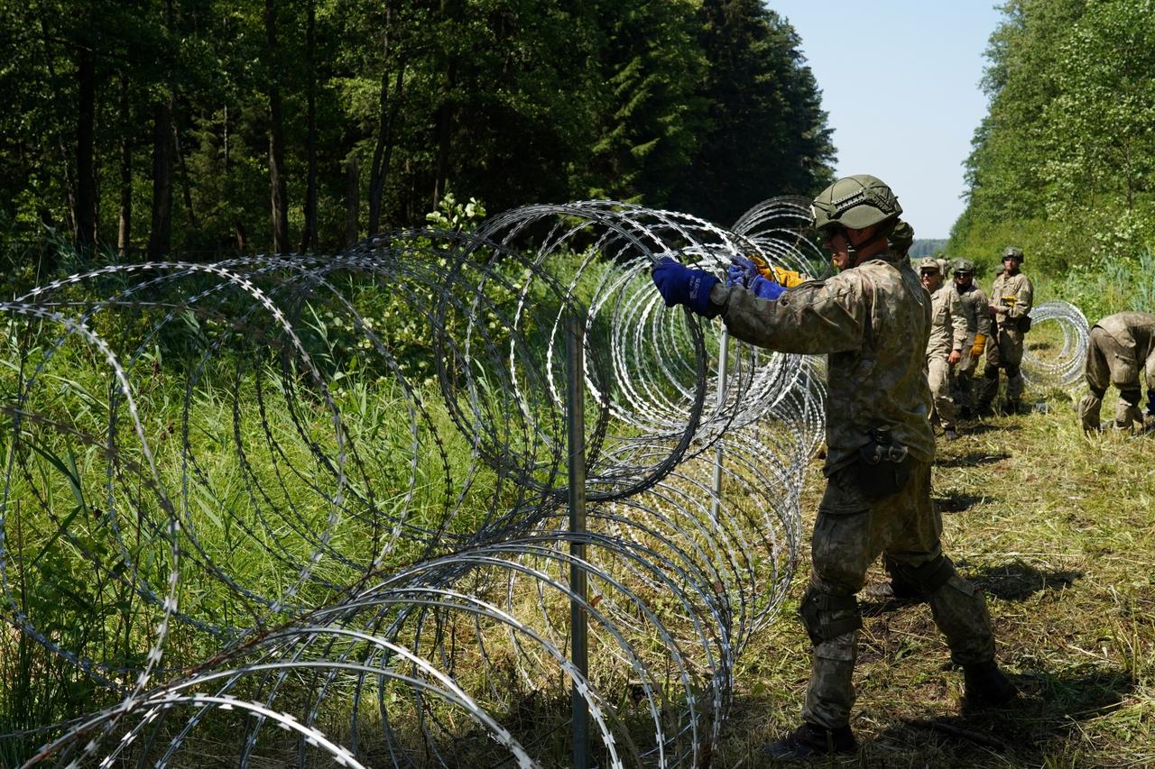 Lithuania toughens Belarus border with razor wire to bar migrants