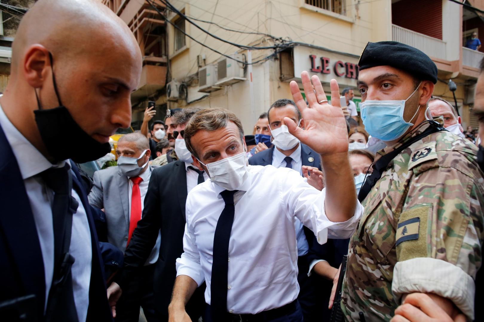 French President Emmanuel Macron visits devastated streets of Beirut French President Emmanuel Macron waves as he visits a devastated street of Beirut, Lebanon August 6, 2020. Thibault Camus/Pool via REUTERS POOL