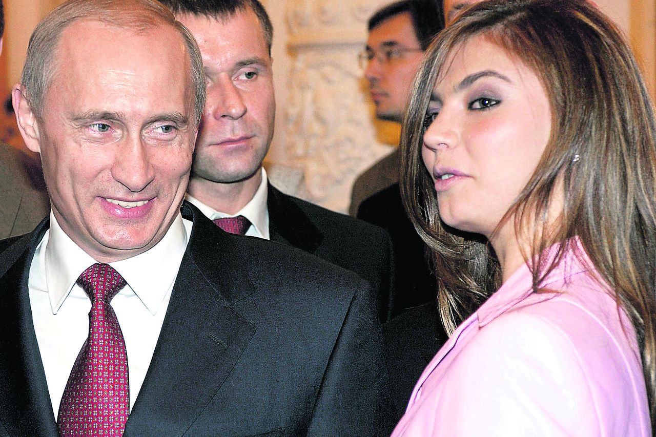 Russian President Vladimir Putin (L) smiles next to Russian gymnast Alina Kabaeva during a meeting with the Russian Olympic team at the Kremlin in Moscow, Russia in this November 4, 2004 file photo. REUTERS/ITAR-TASS/PRESIDENTIAL PRESS SERVICE/Files      