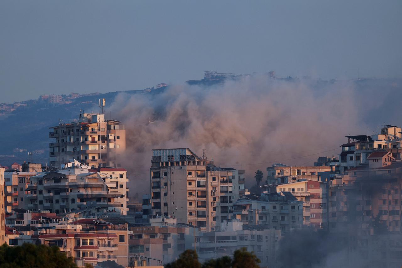 Smoke billows over southern Lebanon following an Israeli strike as seen from Tyre