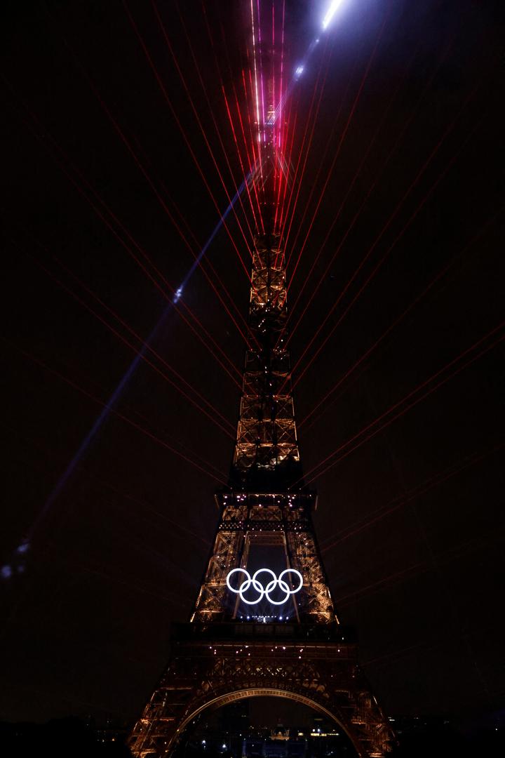 Paris 2024 Olympics - Opening Ceremony - Paris, France - July 26, 2024. The Olympic rings are illuminated on the Eiffel Tower during the opening ceremony of the Paris 2024 Olympic Games. LUDOVIC MARIN/Pool via REUTERS Photo: LUDOVIC MARIN/REUTERS