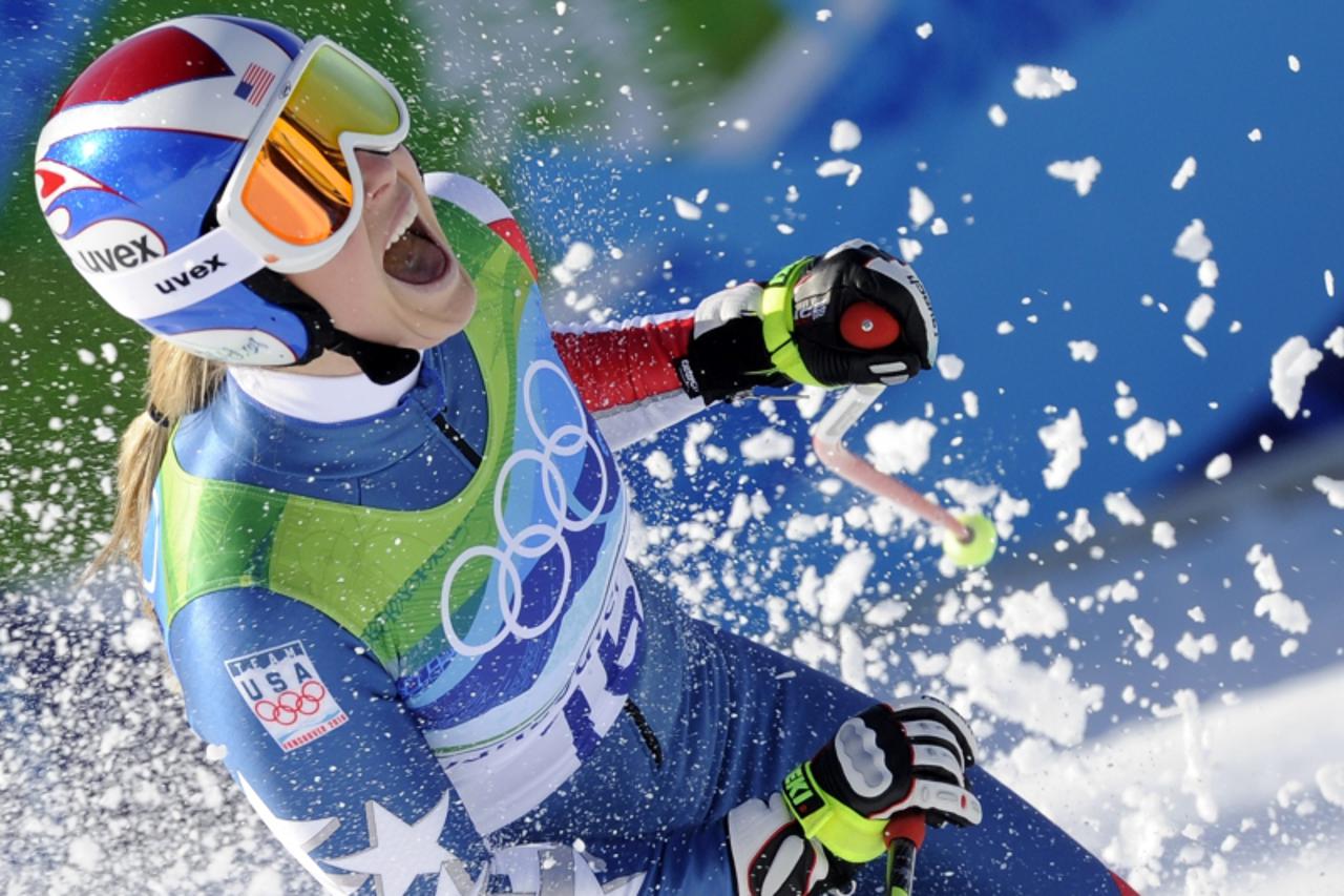 'USA\'s Lindsey Vonn celebrates on the finish line during the Women\'s Vancouver 2010 Winter Olympics Downhill event at Whistler Creek side Alpine skiing venue on February 17, 2010.       AFP PHOTO / 