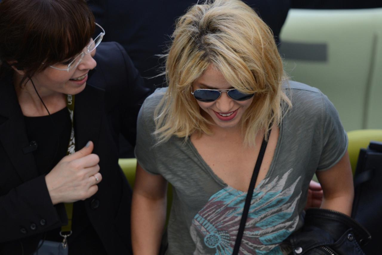 'Colombian singer Shakira reacts at the end of the Euro 2012 championships football match Spain vs Italy on June 10, 2012 at the Gdansk Arena.     AFP PHOTO/ PATRIK STOLLARZ '