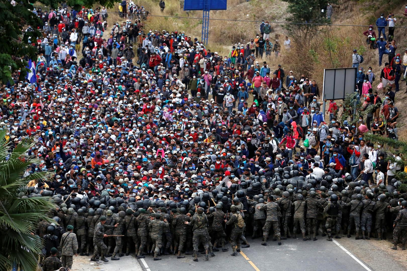 Hondurans take part in a new caravan of migrants set to head to the United States Hondurans taking part in a new caravan of migrants set head to the United States, clash with Guatemalan soldiers as they try to cross into Guatemalan territory, in Vado Hondo, Guatemala January 17, 2021. REUTERS/Luis Echeverria LUIS ECHEVERRIA