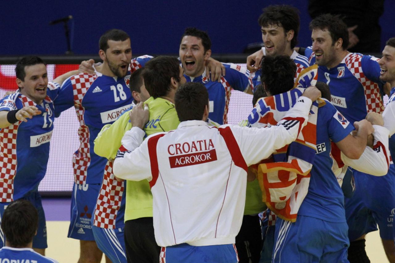 \'Croatia\'s players celebrate a victory over Spain in their Men\'s European Handball Championship match for third place in Belgrade January 29, 2012.       REUTERS/Stoyan Nenov (SERBIA  - Tags: SPORT