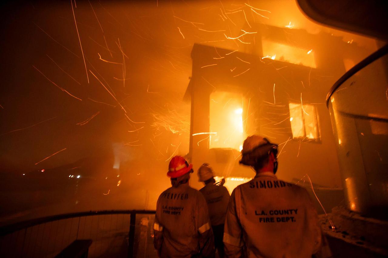 Palisades fire burns during a windstorm on the west side of Los Angeles