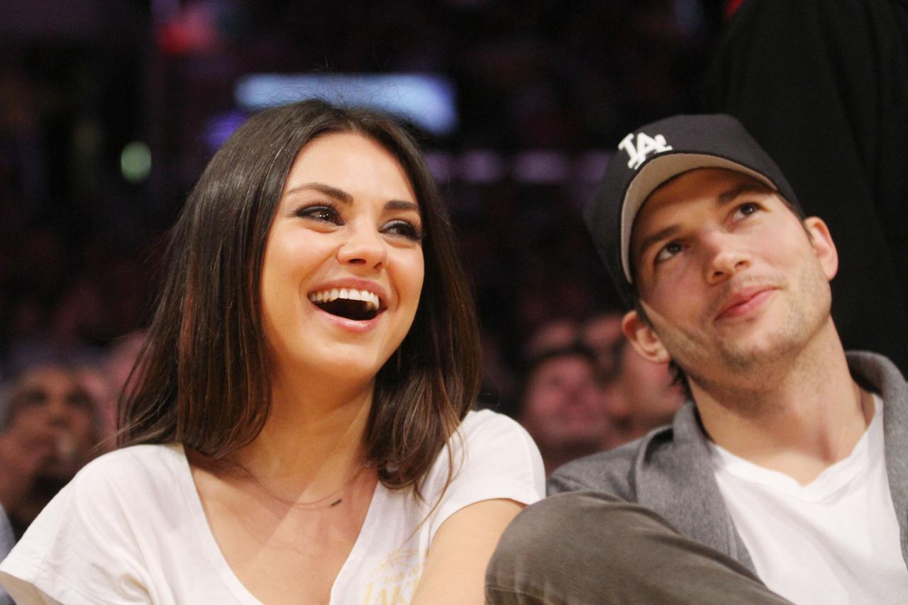 Celebrities watch the LA Lakers vs. Phoenix Suns at the Staples Center  *****FILE PHOTO*** MILA KUNIS PREGNANT - REPORT Actress MILA KUNIS is reportedly expecting her first child with her new fiance ASHTON KUTCHER.   Just weeks after the Black Swan beauty