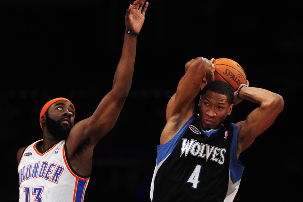 \'Minnesota Timberwolves guard Wesley Johnson of the Rookie Team (R) pulls down a rebound against Oaklahoma City Thunder guard James Harden of the Sophmore Team (L) during the NBA All Star - Rookie Ch