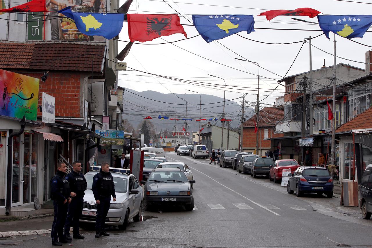 Kosovo police officers patrol in ethnically mixed area in North Mitrovica