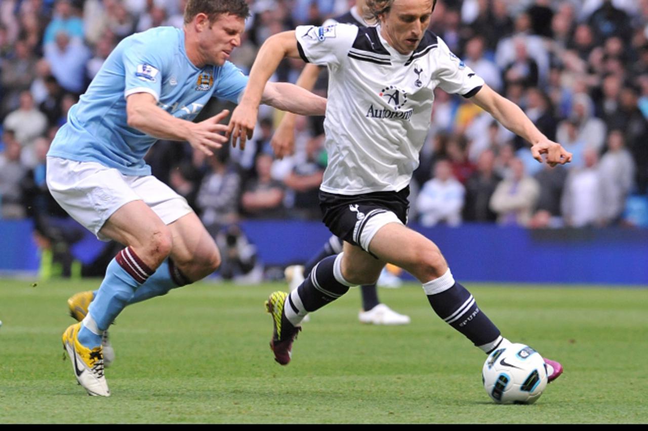 \'Manchester City\'s James Milner (left) and Tottenham Hotspur\'s Luka Modric (right) battle for the ball. Photo: Press Association/Pixsell\'