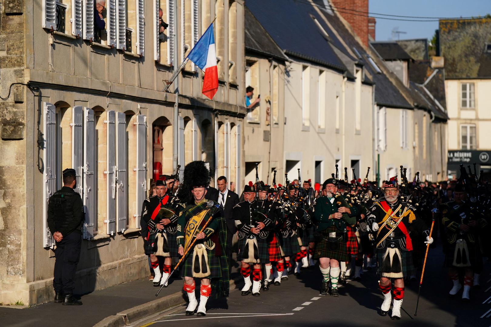 International pipers from France, Germany and the United Kingdom during a procession from Bayeux Cathedral to the Great Vigil at the Commonwealth War Grave Commission's  Bayeux War Cemetery in Normandy, France, to commemorate the 80th anniversary of D-Day. June 5, 2024. Aaron Chown/Pool via REUTERS Photo: Aaron Chown/REUTERS