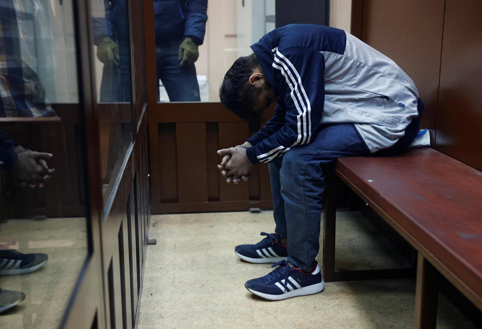 Dalerdzhon Mirzoyev, a suspect in the shooting attack at the Crocus City Hall concert venue, sits behind a glass wall of an enclosure for defendants at the Basmanny district court in Moscow, Russia March 24, 2024. REUTERS/Yulia Morozova Photo: YULIA MOROZOVA/REUTERS