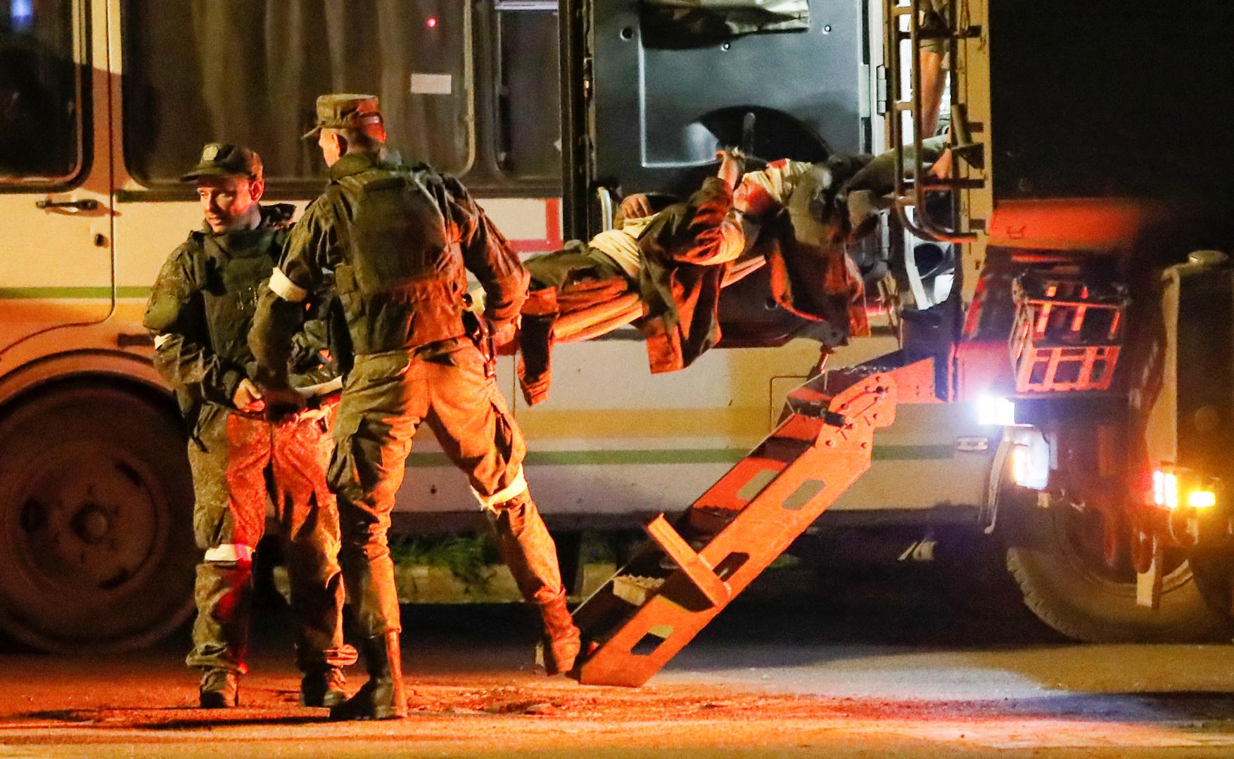 A wounded service member of Ukrainian forces from the besieged Azovstal steel mill in Mariupol is transported on a stretcher out of a bus, which arrived under escort of the pro-Russian military in the course of Ukraine-Russia conflict in Novoazovsk, Ukraine May 16, 2022. REUTERS/Alexander Ermochenko Photo: Alexander Ermochenko/REUTERS