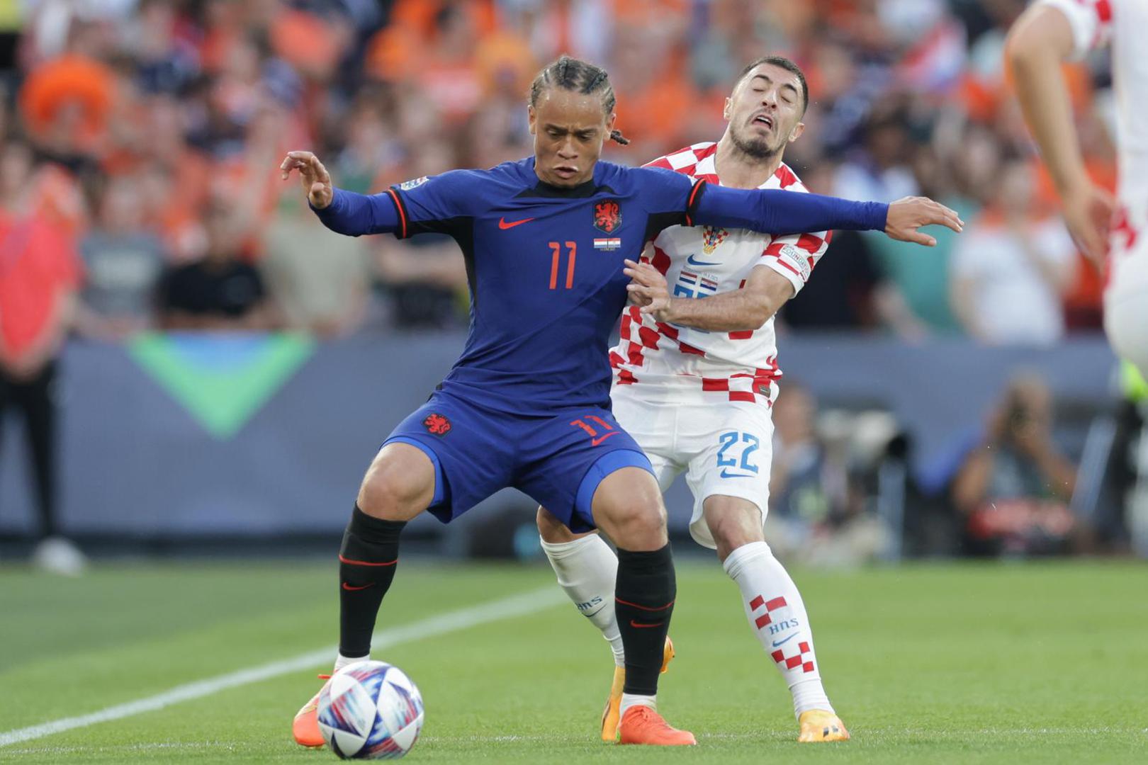 14.06.2023., stadion Feyenoord "De Kuip", Rotterdam, Nizozemska - UEFA Liga Nacija, polufinale, Nizozemska - Hrvatska. Xavi Simons, Josip Juranovic Photo: Luka Stanzl/PIXSELL