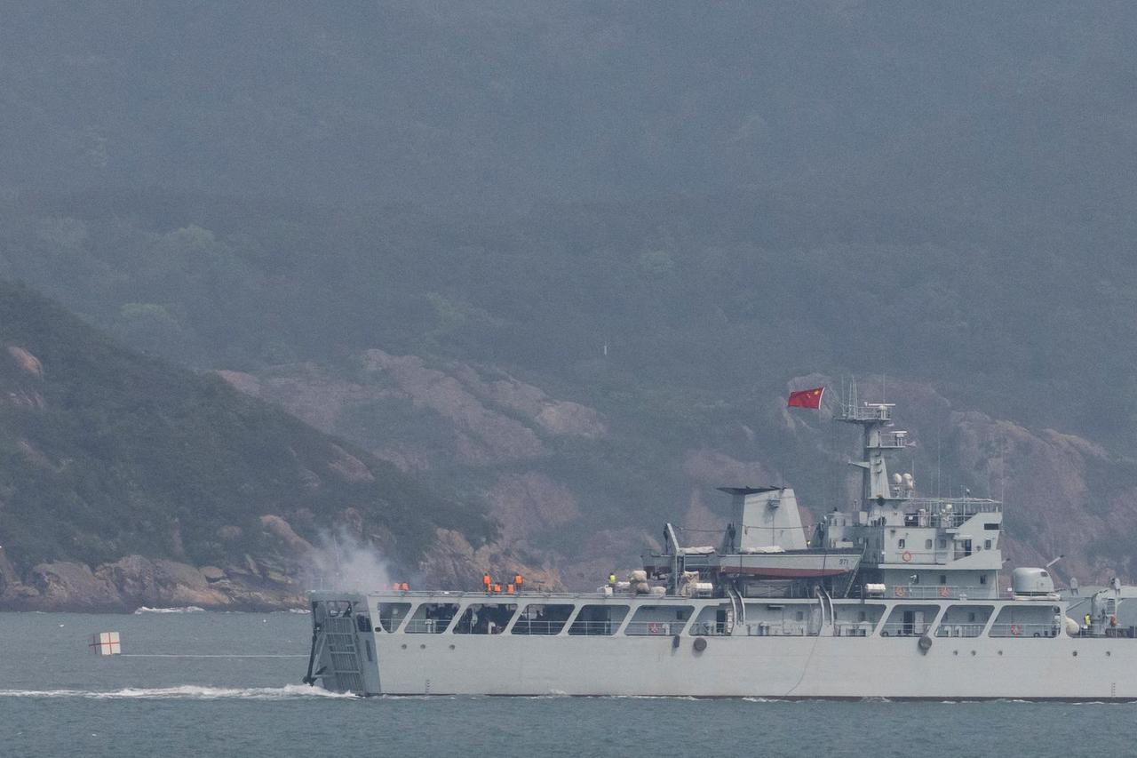 A Chinese warship fires towards the shore during a military drill near Fuzhou near the Taiwan controlled Matsu Islands