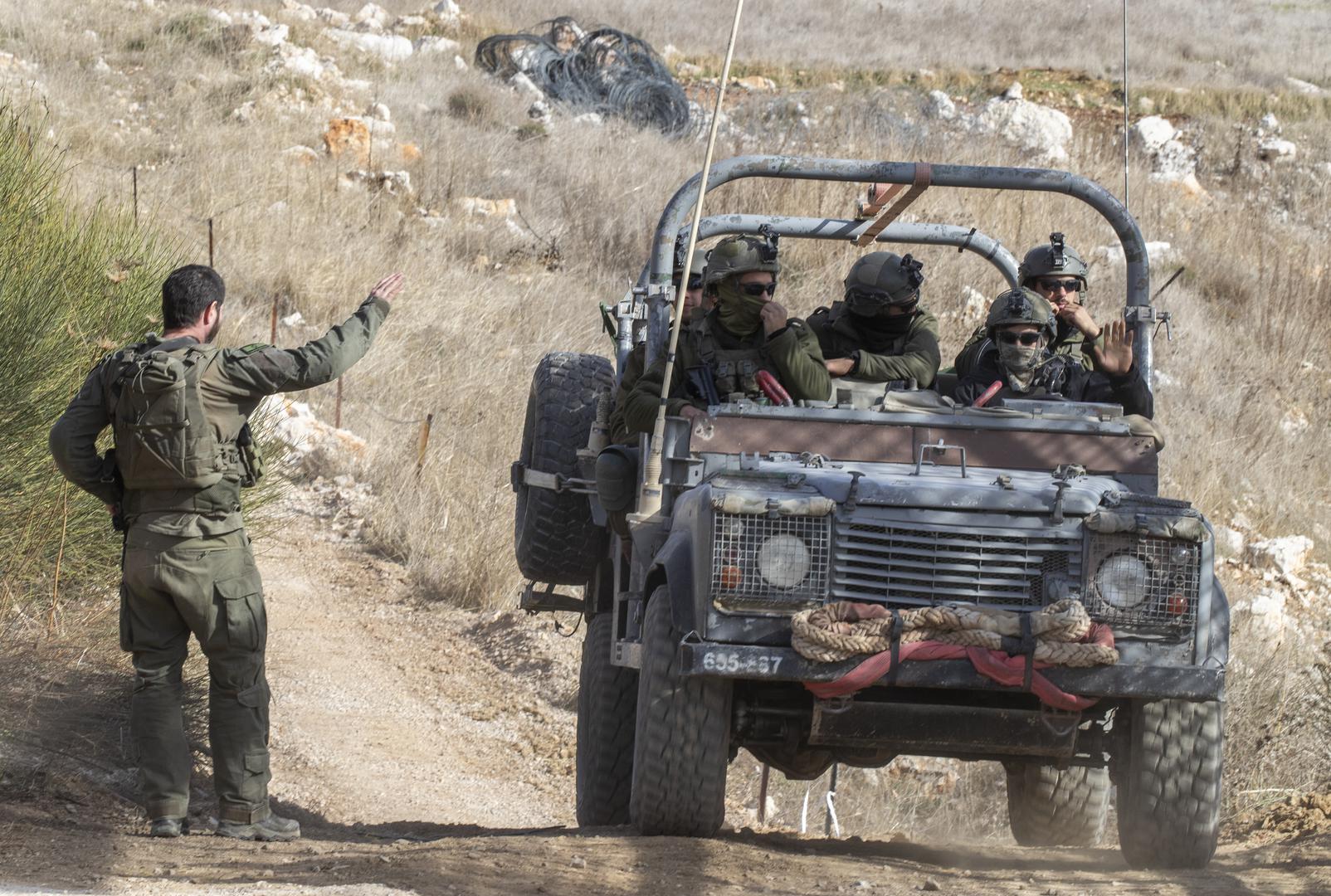 An Israeli soldier waves to a jeep of soldiers exiting from Syria into Israeli through the border fence with Syria in the northern Israeli-controlled Golan Heights on December 10, 2024. Israel is extending is presence on the ground inside Syria following the Syrian rebel takeover of most of the country in the past days. Photo by Jim Hollander/UPI Photo via Newscom Photo: JIM HOLLANDER/NEWSCOM