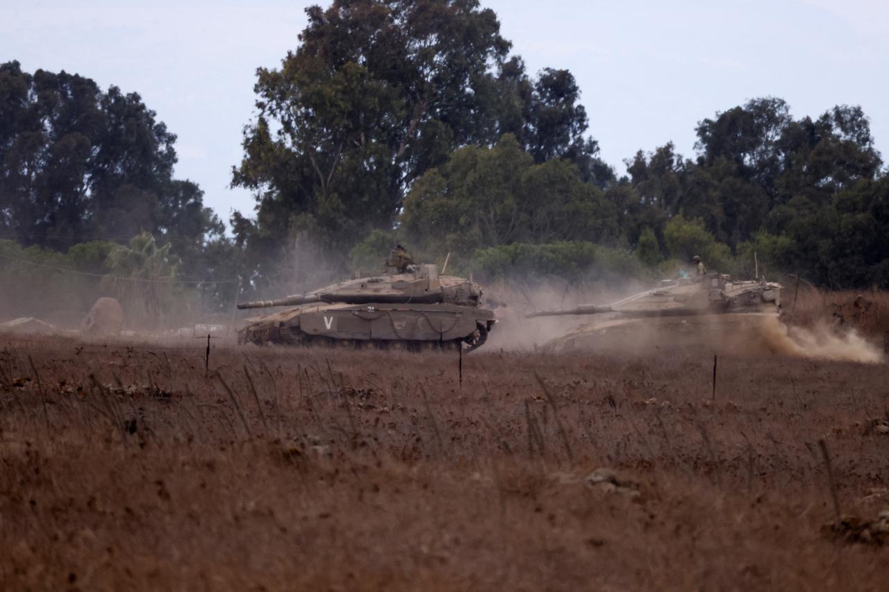 Israeli Army tanks are being moved, in the Israeli-occupied Golan Heights