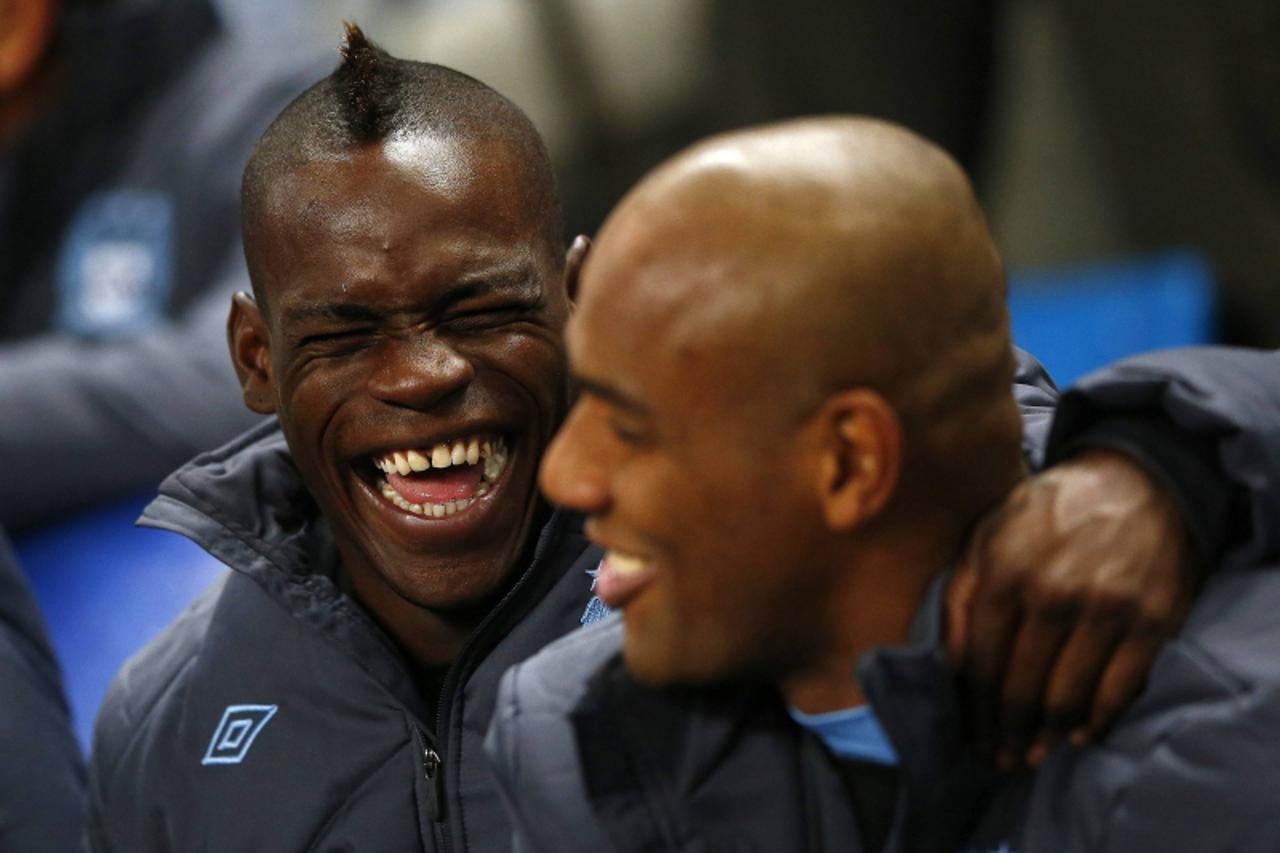 'Manchester City\'s Mario Balotelli (L) reacts ahead of their Champions League Group D soccer match against  Ajax Amsterdam at The Etihad Stadium in Manchester, northern England, November 6, 2012.   R