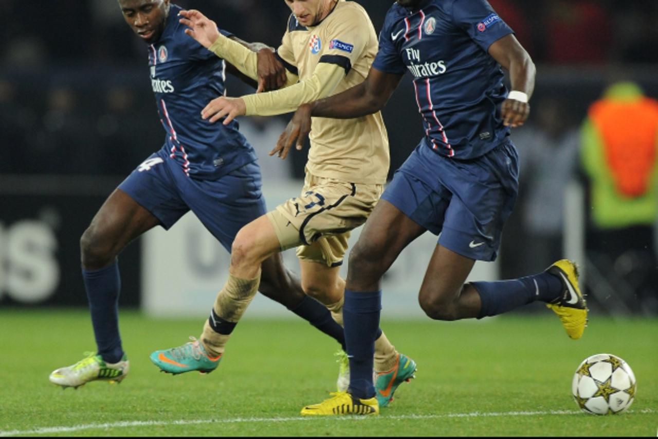 'Paris Saint-Germain's Blaise Matuidi (left) and Mohamed Sissoko (right) challenge Dinamo Zagreb's Marcelo BrozovicPhoto: Press Association/PIXSELL'