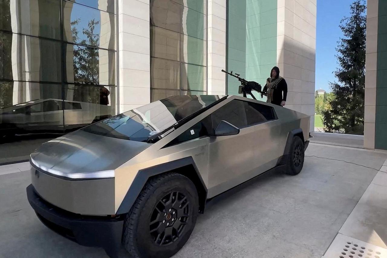 Leader of Russia's Chechnya region Ramzan Kadyrov is seen atop what is said to be a Tesla Cybertruck equipped with a machine gun, in Grozny