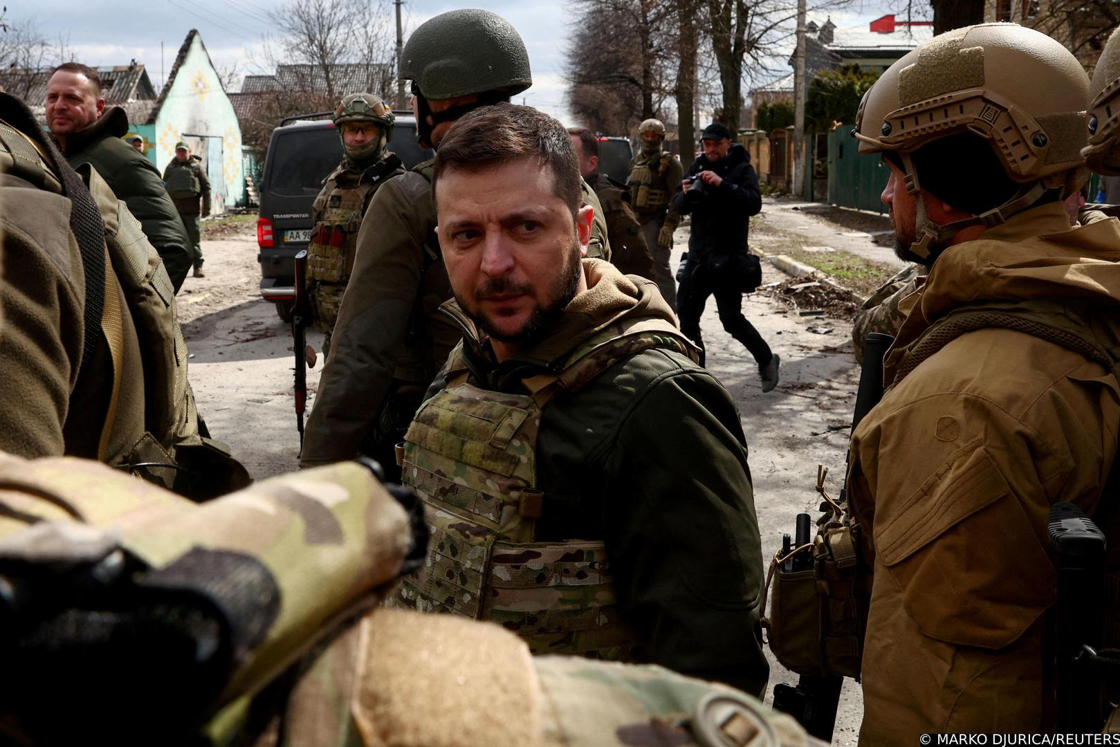 Ukraine's President Volodymyr Zelenskiy looks on as he is surrounded by Ukrainian servicemen as Russia's invasion of Ukraine continues, in Bucha, outside Kyiv, Ukraine, April 4, 2022. REUTERS/Marko Djurica       TPX IMAGES OF THE DAY Photo: MARKO DJURICA/REUTERS