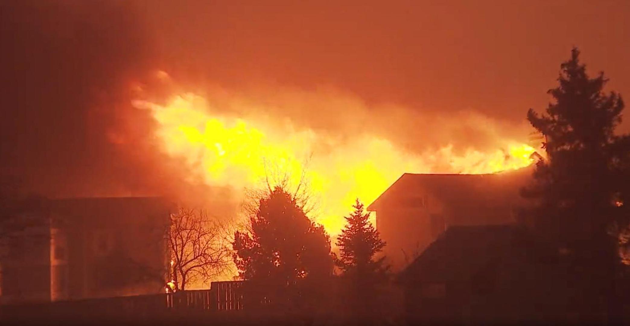 A house burns as a wind-driven wildfire forced evacuation of the Superior suburb of Boulder, Colorado, U.S. December 30,2021 in this still image obtained from a social media video. Eric English/via REUTERS THIS IMAGE HAS BEEN SUPPLIED BY A THIRD PARTY. MANDATORY CREDIT. NO RESALES. NO ARCHIVES.