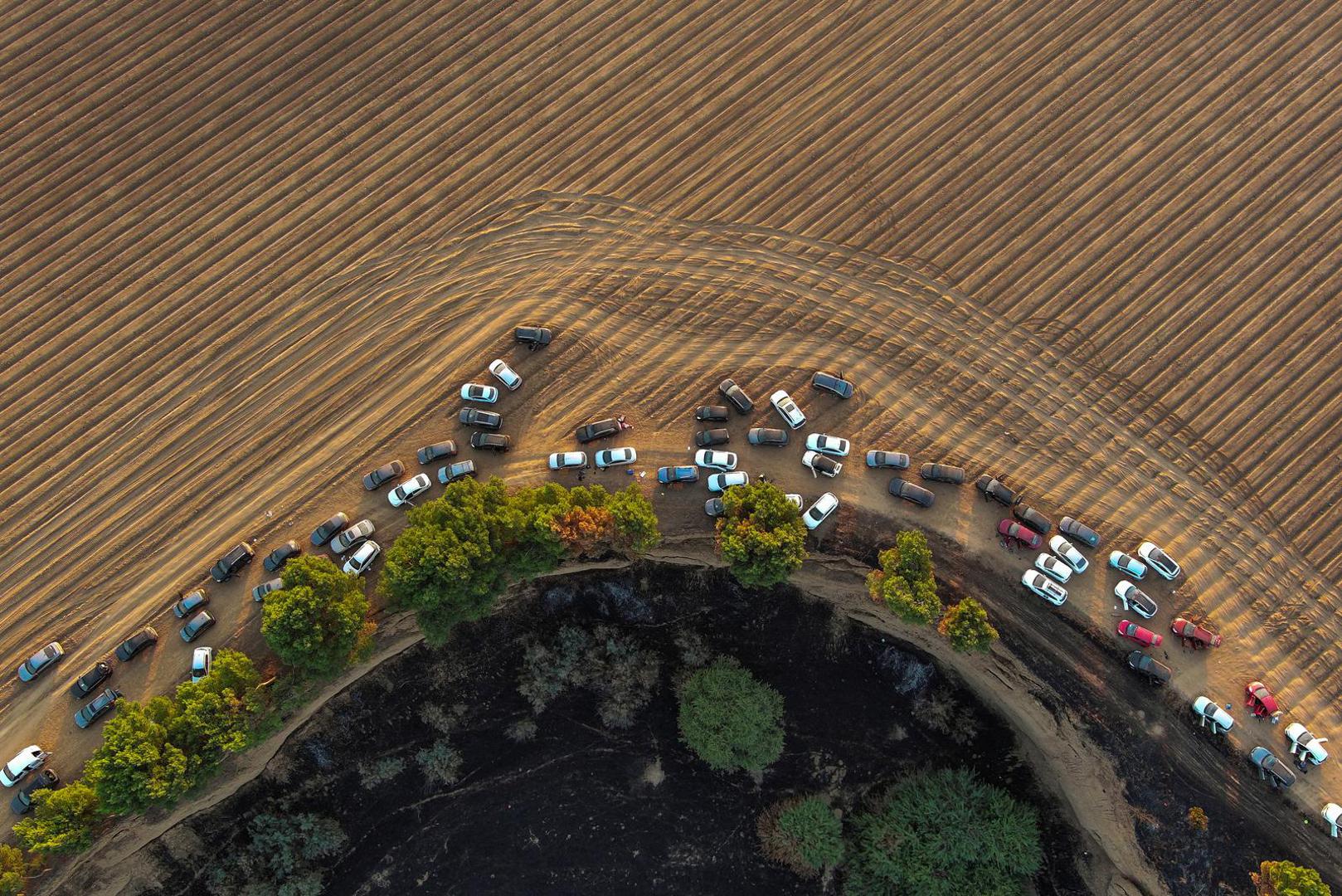 An aerial view shows deserted cars of festival-goers at the site of an attack on the Nova Festival by Hamas gunmen from Gaza, near Israel's border with the Gaza Strip, in southern Israel, October 12, 2023. REUTERS/Ilan Rosenberg Photo: ILAN ROSENBERG/REUTERS