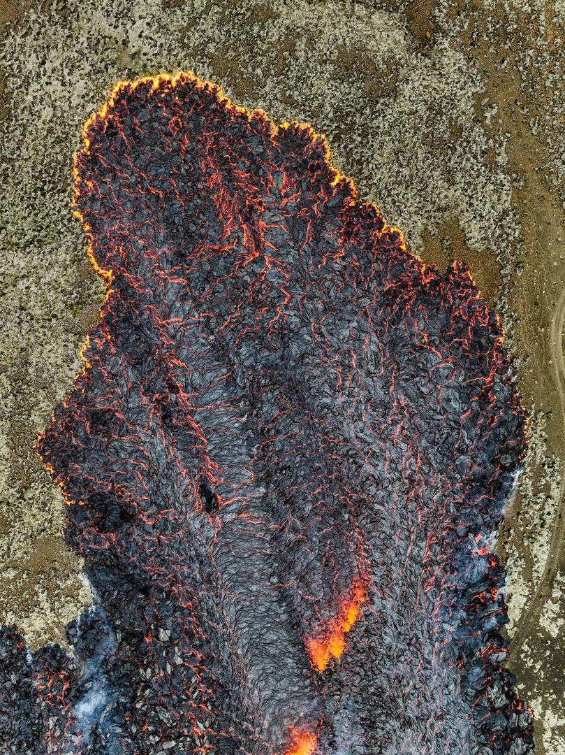 Lava flows after the eruption of a volcano, on the Reykjanes peninsula, near the capital Reykjavik, in southwest Iceland, July 10, 2023, in this picture obtained from social media. Juergen Merz - Glacier Photo Artist/via REUTERS  THIS IMAGE HAS BEEN SUPPLIED BY A THIRD PARTY. MANDATORY CREDIT. NO RESALES. NO ARCHIVES. Photo: JUERGEN MERZ - GLACIER PHOTO ART/REUTERS