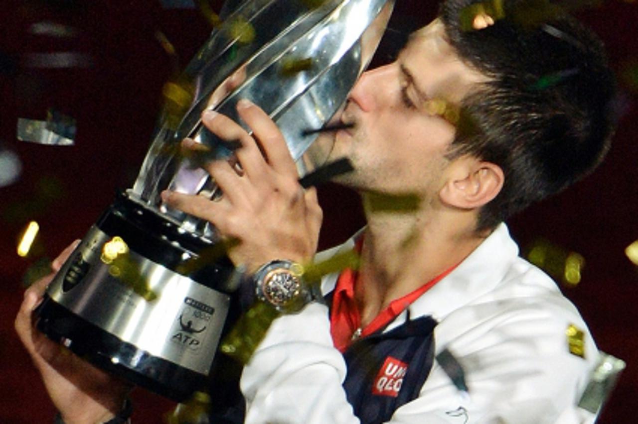 'Novak Djokovic of Serbia kisses the winners trophy after defeating Andy Murray of Britain during their finals match at the Shanghai Masters tennis tournament in Shanghai on October 14, 2012.  Djokovi