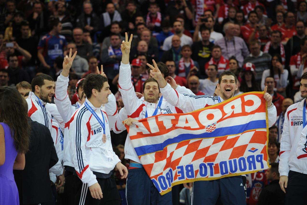 'Croatia\'s players celebrate their bronze medal during the podium ceremony of the men\'s EHF Euro 2012 Handball Championship on January 29, 2012 at the Beogradska Arena in Belgrade. Denmark won the t