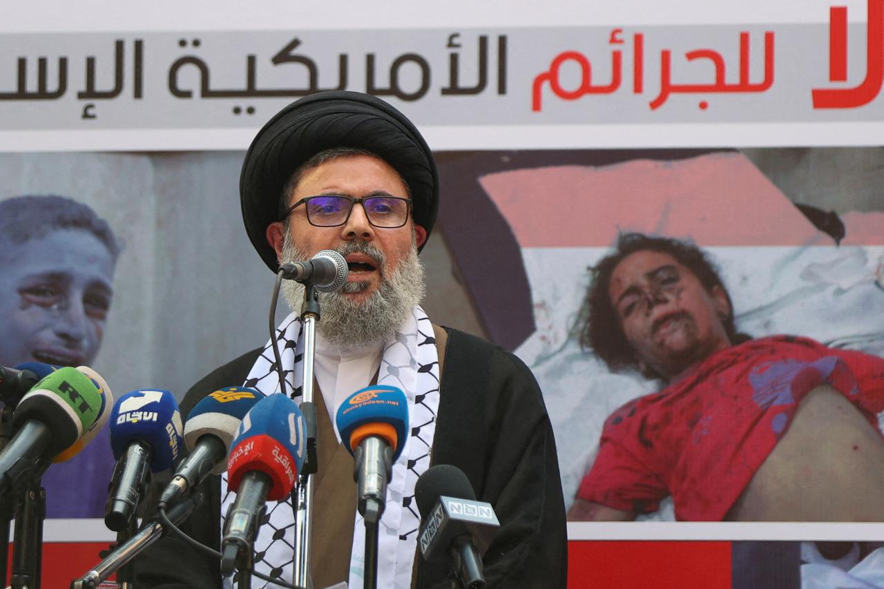 FILE PHOTO: Hezbollah supporters protest over Gaza hospital strike, in Beirut